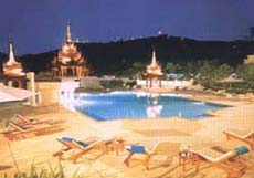 Swimming pool with the background of Mandalay hill