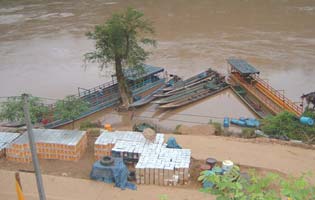 Boats on Salawin river waiting for cargo to send to Myanmar